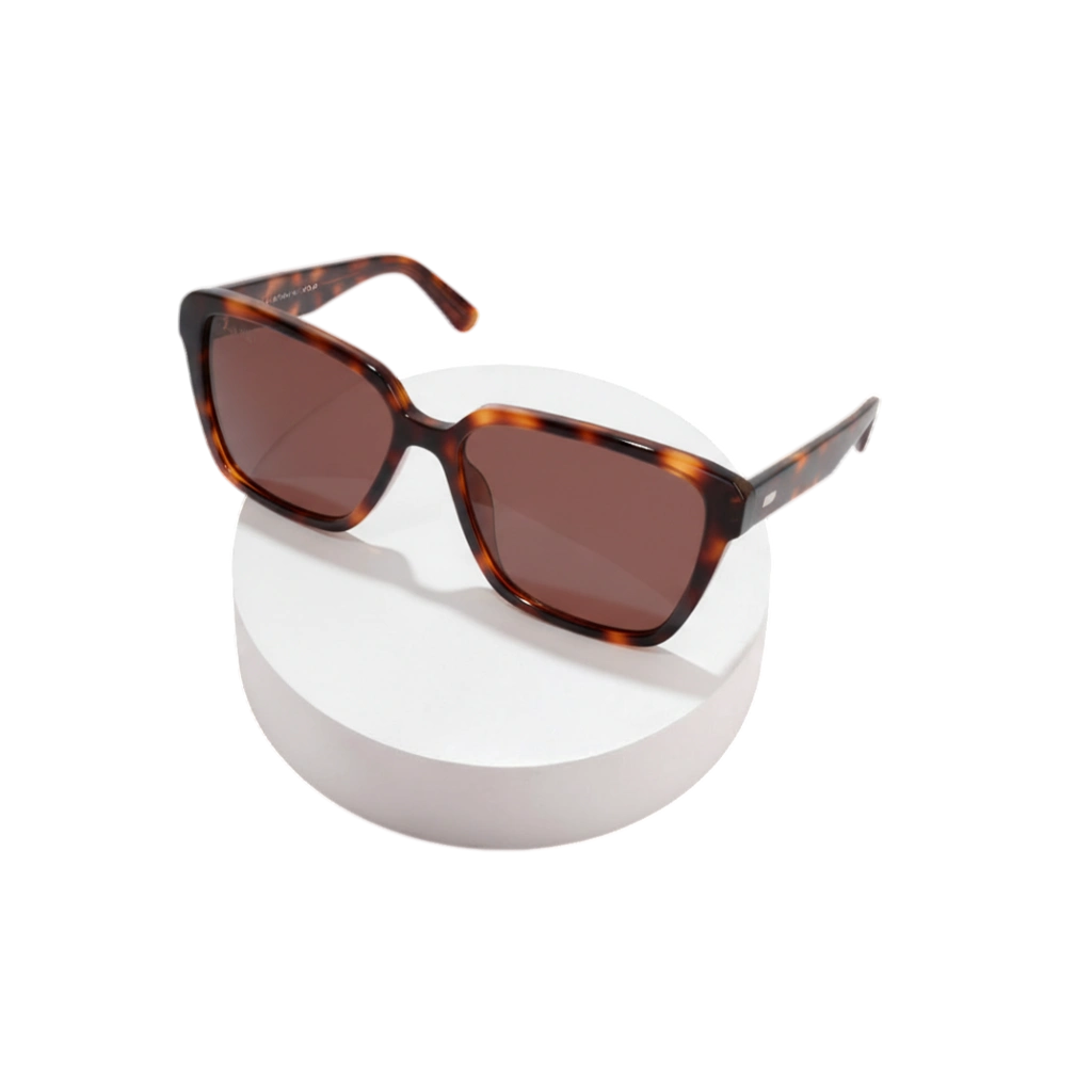 White Angel tortoise shell square sunglasses on a white circular stand.